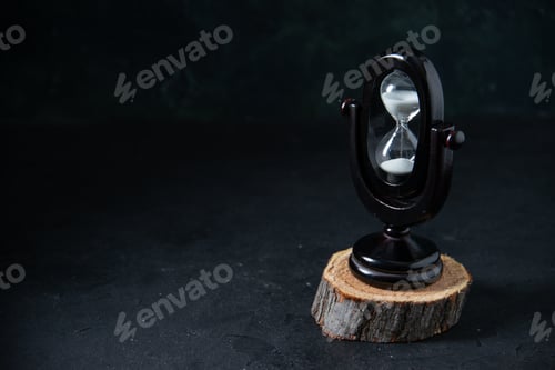 Preview: front view of black hourglass on a dark surface funeral war death time israel evil