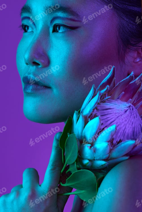Preview: Cropped shot of an attractive young woman posing in studio against a purple background