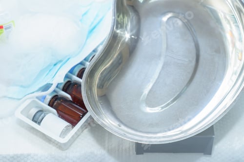 Preview: Vaccine or beauty treatment peeling or Botox ampules and metal medical plate on a table