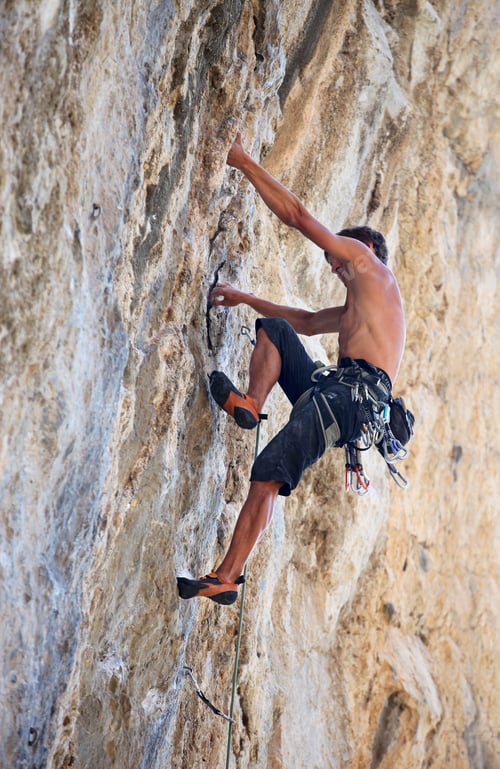 Preview: Rock climber on a face of a cliff