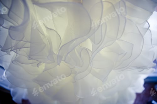 Preview: Detail of the texture of the fabric of a white wedding dress.