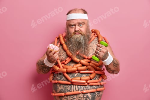 Preview: Weight loss, dieting and fitness concept. Serious bearded fatty man holds high calorie sweet donut,