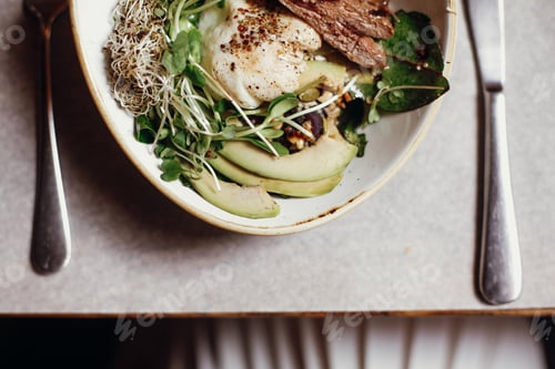 Preview: Delicious salad with juicy grill steak, avocado, sprouted greens, leaves, egg pouch, nuts