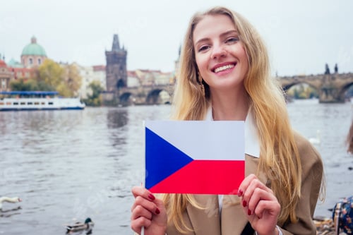 Preview: woman with an appetite eats a traditional The Charles Bridge and wawing with flag