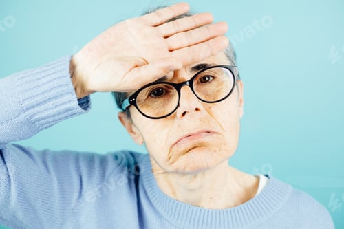 Preview: Old woman putting his hand on the forehead to check the temperature, health on senior people