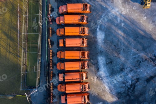 Preview: Aerial top view of trucks parked at a green field in Westchester, New York