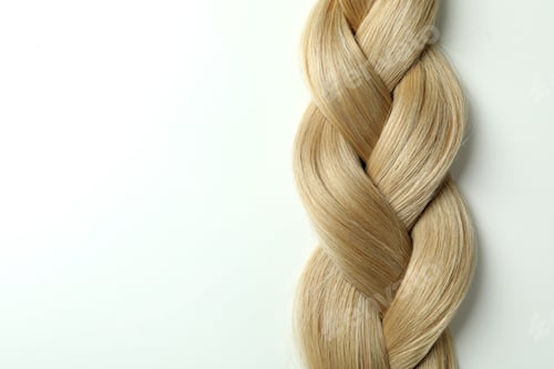 Preview: Light female hair on white background, close up