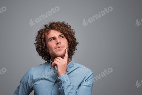 Preview: Thoughtful man looking up