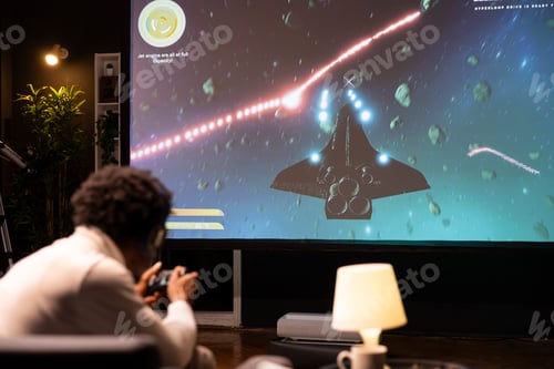 Preview: Gamer enjoying high quality game, flying spacecraft with gamepad