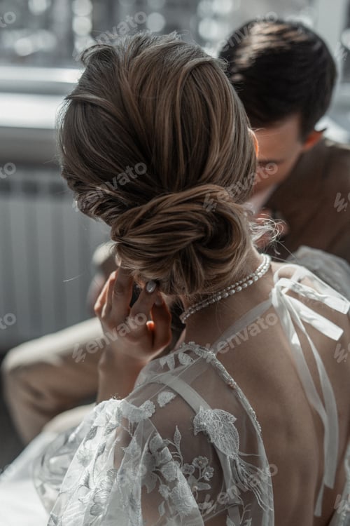 Beautiful Bride With Groom Near the Window