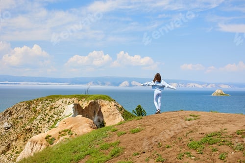 Preview: A young girl travels on Lake Baikal in the summer. Beautiful landscape of Olkhon Island