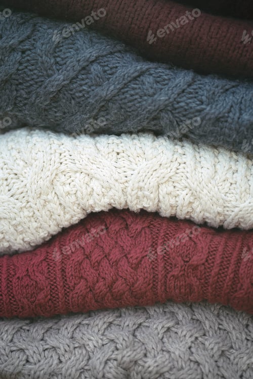 Preview: a stack of knitted sweaters