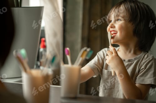 Preview: Cute baby brushing his teeth in the bathroom. The child observes hygiene, healthy lifestyle