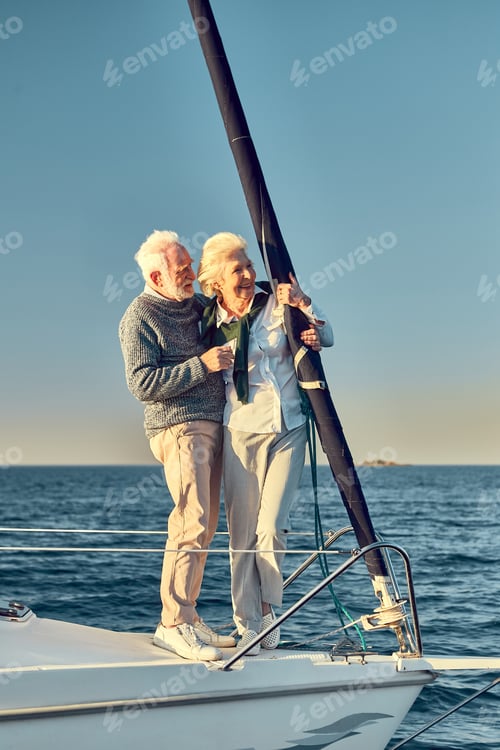 Preview: Full leghth of beautiful happy senior couple in love, retired man and woman standing on