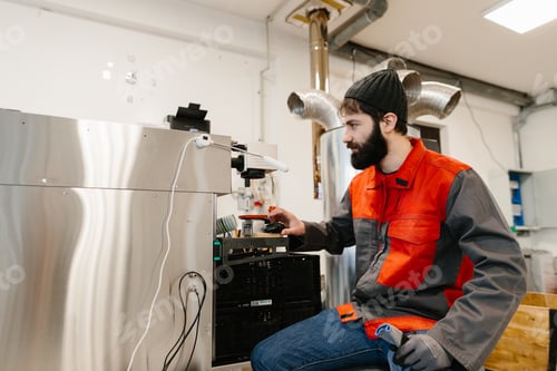 Preview: Employee operating coffee roasting quality control machine