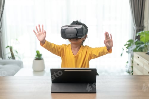 Preview: Cute girl wearing virtual reality googles at home,
