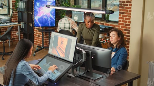 Preview: Employees doing it work to develop new interface in agency studio