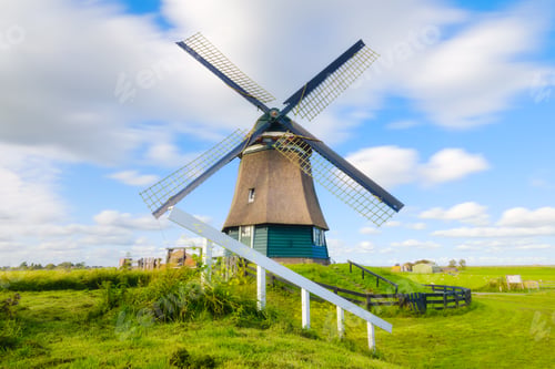 Preview: Landscape with windmill. Dutch. Agricultural fields and pastures. Summer landscape in the Netherland