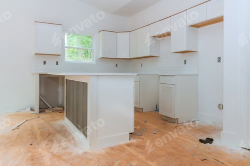 Preview: Modern kitchen renovation in progress with fresh white cabinets unfinished wooden floors