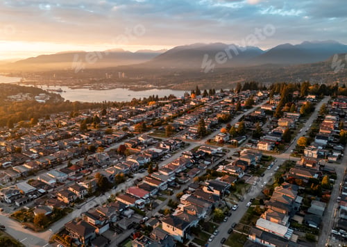 Preview: Aerial View Of Suburban Neighborhood At Sunset With Mountain Backdrop In Burnaby, Vancouver
