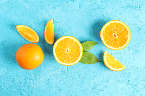 Preview: Flat lay composition with ripe oranges and leaves on color background. Top view, space for text