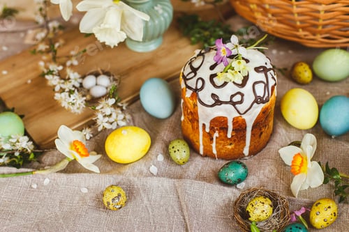 Preview: Homemade easter bread and natural dyed easter eggs with spring flowers