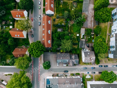 Preview: Scenic landscape from above aerial view of houses in small town in countryside Germany .