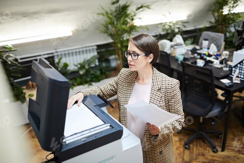 Preview: Businesswoman Scanning Documents