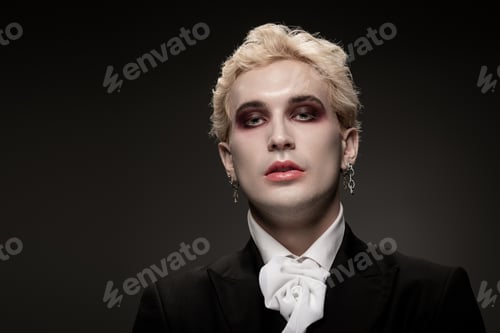 Preview: Handsome young man showcases stunning Halloween costume with bold makeup