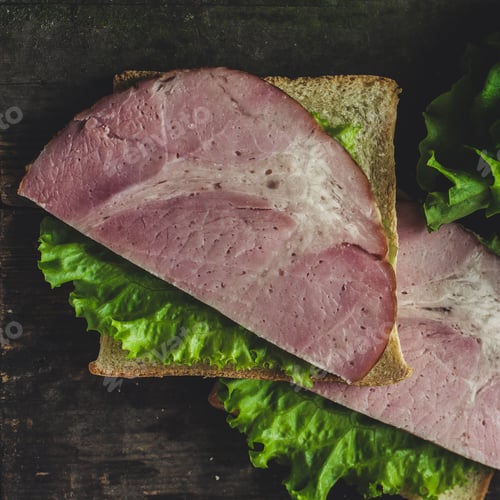 Preview: Sandwich With Meat (Ham), Lettuce Leaf, Cucumber And Sauce (On The Table - Background)
