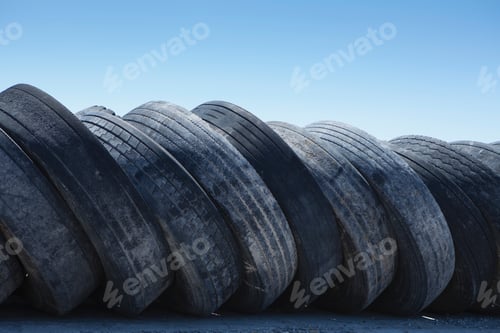 Preview: A row of discarded rubber tires.