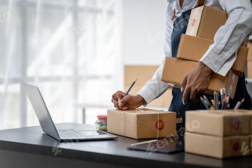 Preview: Pretty young african american woman start up freelance business people is working at warehouse