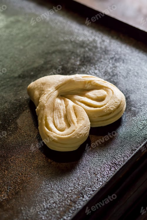 Preview: Raw dough in a heart shape.
