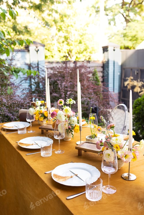 Preview: Wedding table for guests, decorated with candles, are served with cutlery and crockery