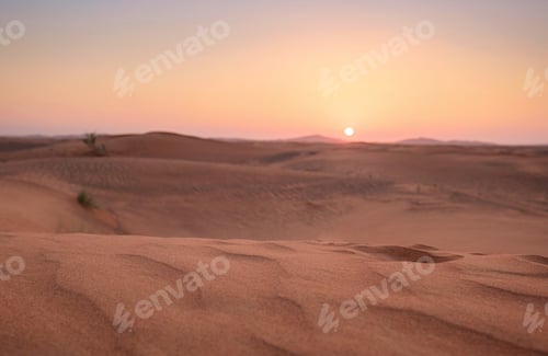 Preview: Sunset over the sand dunes in the desert.