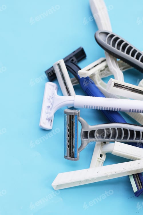 Preview: Used razor waste on blue background.