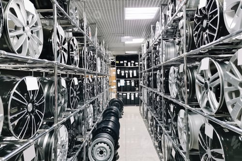 Preview: Auto shop selling car rims. Stand for sale of alloy wheels. Discounts at auto parts store.
