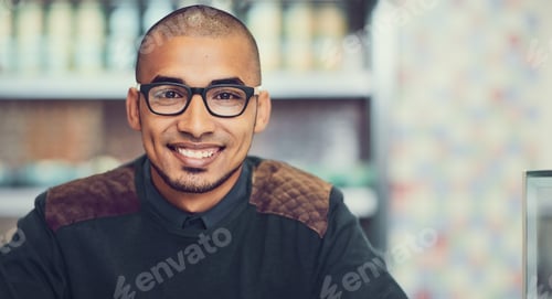 Preview: Im here for my daily dose of caffeine. Portrait of a young man sitting in a cafe.