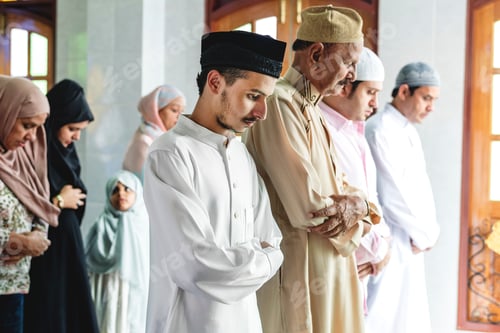 Devout People Praying Together Indoors with Respect