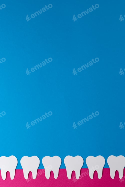 Preview: Vertical composition of row of white teeth in pink gum on blue background, with copy space