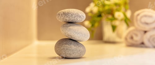 Preview: Zen stones, smooth pebbles pyramid stacked balance, bath interior background.