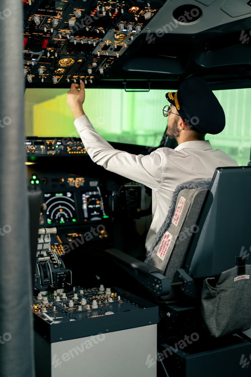 Preview: Airplane cabin The pilot checks the electronics by pressing the buttons Preparing passenger liner