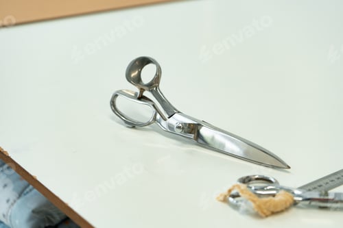 Preview: Tailor's work desk with sewing tools close up