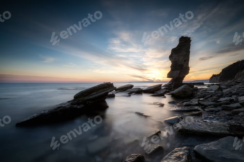 Preview: Sea sunrise at rocky coastline