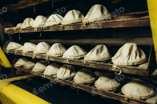 Preview: The process of baking bread. Unleavened bread. Baker's hand in the frame. Sprinkle bread molds