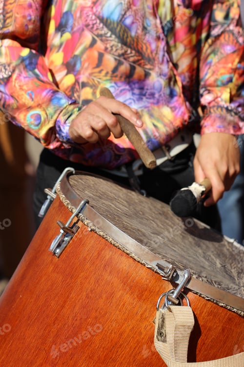 Preview: Person playing drum at the traditional religious festival of min