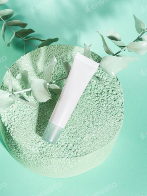 Preview: Skin care generic product cream tube on green podium