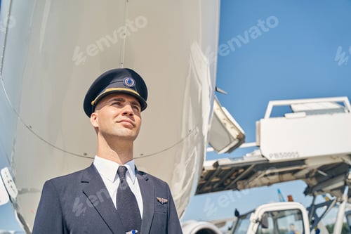 Preview: Pensive Caucasian pilot staring into the distance