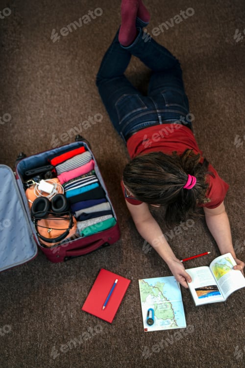 Preview: Person packing and planning a trip