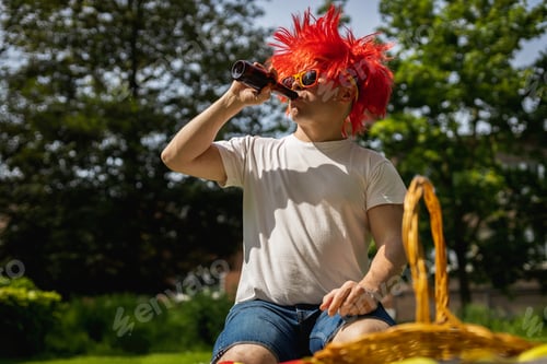 Preview: Portrait of a young man with beer celebrating belgium day.